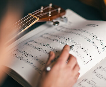 woman studying a musical score